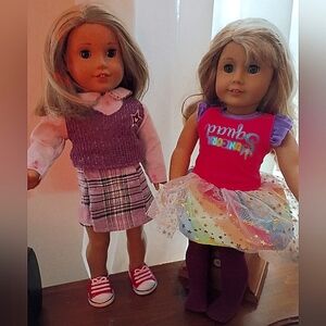 American Girl Dolls with Pink and Purple Outfits